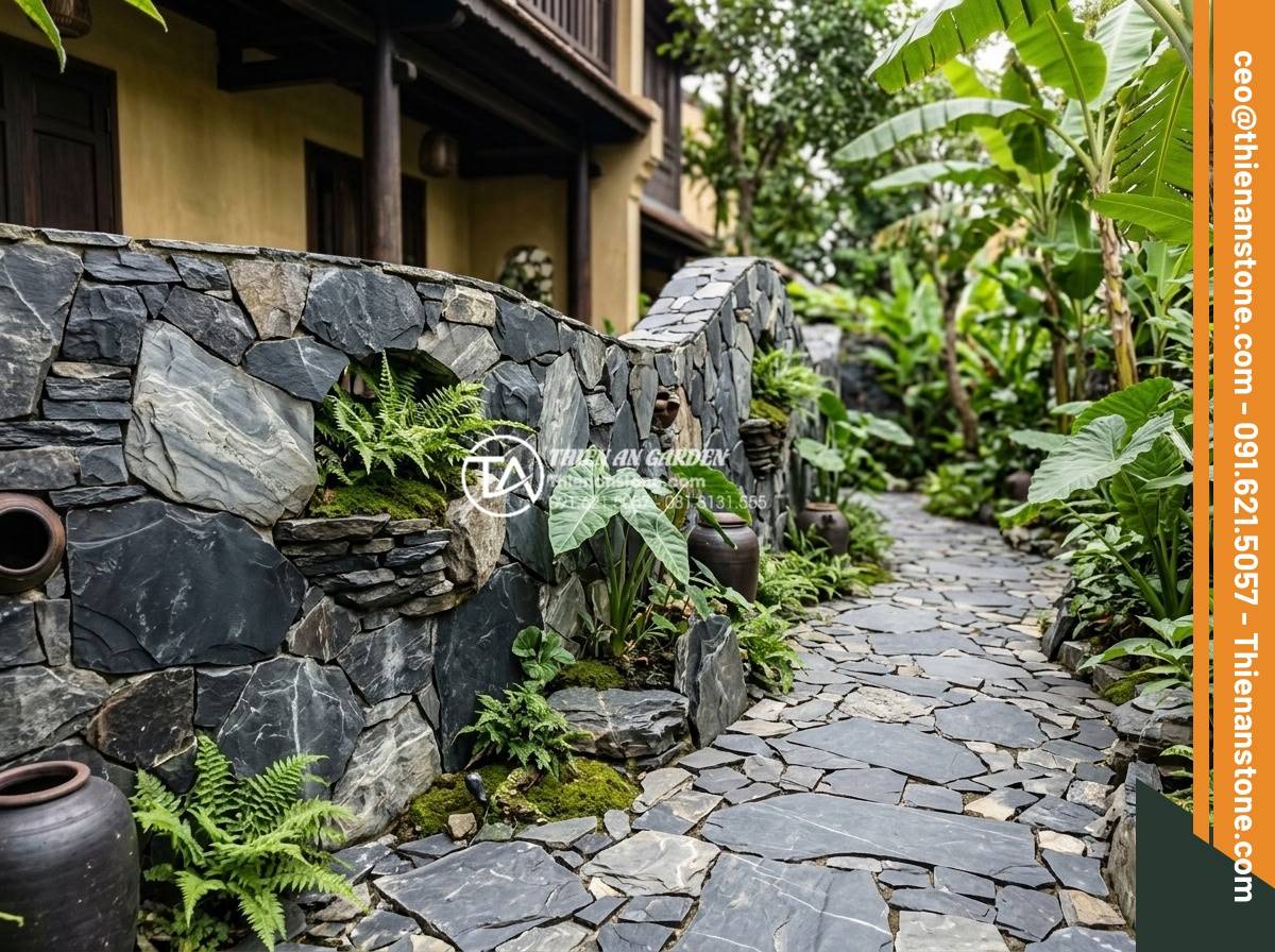 Cách chọn màu đá rối hợp mệnh gia chủ trong kiến trúc - Multi-hued rubble stones integrated into artistic wall and pathway in villa exte