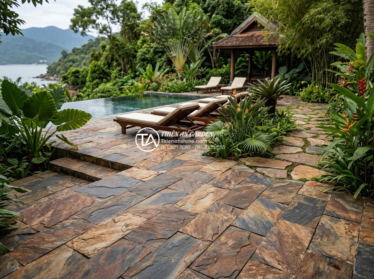 Có nên lát sân vườn bằng đá rối? Phân tích ưu và nhược điểm - Resort-style garden with extensive natural stone paving, infinity pool edge, lou