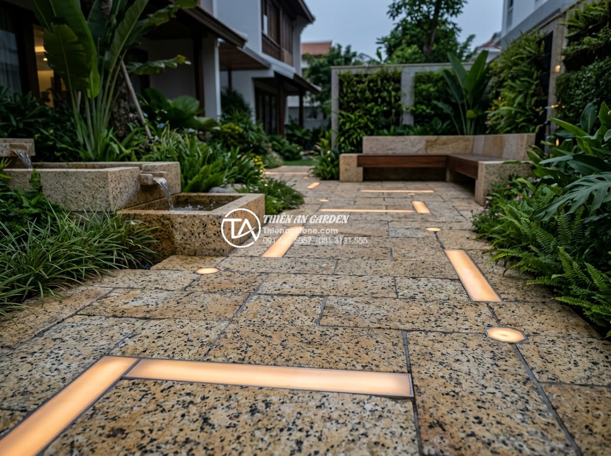Có nên lát sân vườn bằng đá rối? Phân tích ưu và nhược điểm - Futuristic 2026 garden concept with smart lighting integrated into tumbled stone