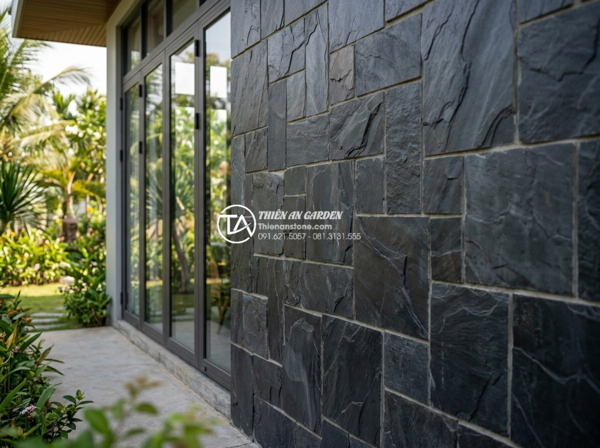 Đá rối vàng Bình Định vs Nghệ An: Sự khác biệt về chất lượng và màu sắc - Decorative wall using Binh Dinh yellow stones in a modern villa exterior with de