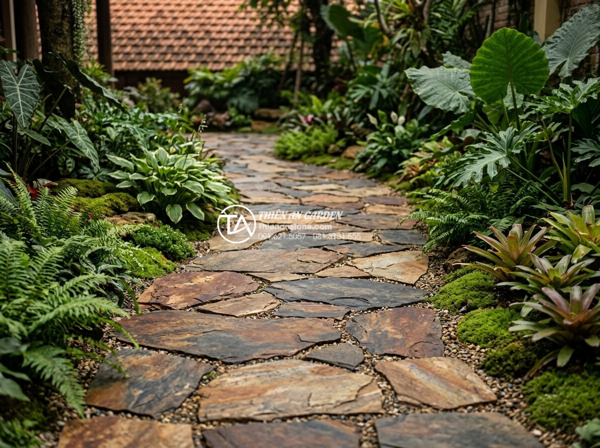 Quy trình lát sân bằng đá rối: Checklist 5 bước đạt chuẩn chuyên gia - Completed high-quality irregular stone paved garden with lush landscaping, ready