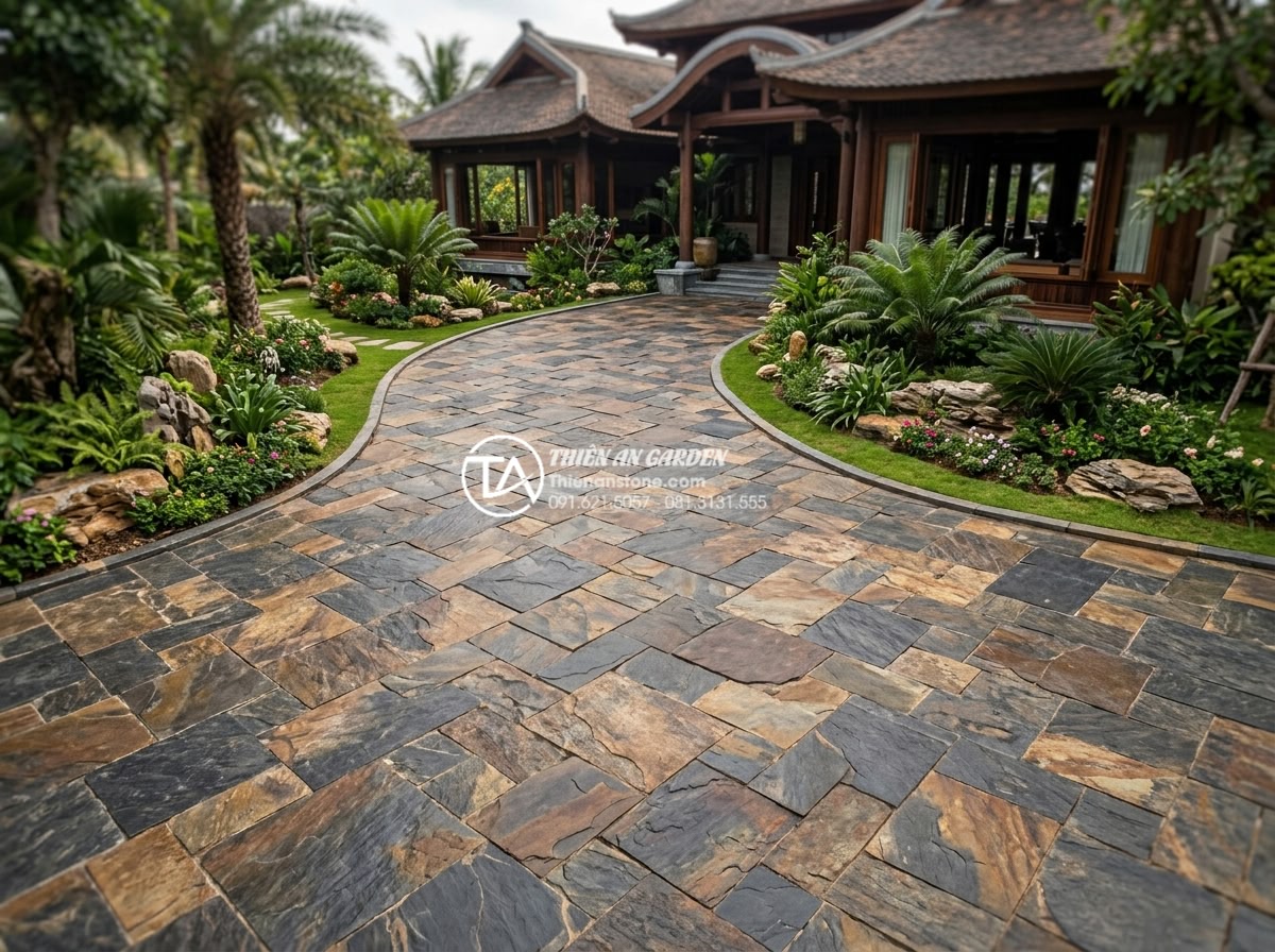 Review độ bền đá rối đen Lai Châu khi lát đường đi ô tô - Luxurious overview of stone-paved driveway leading to a high-end residence, high