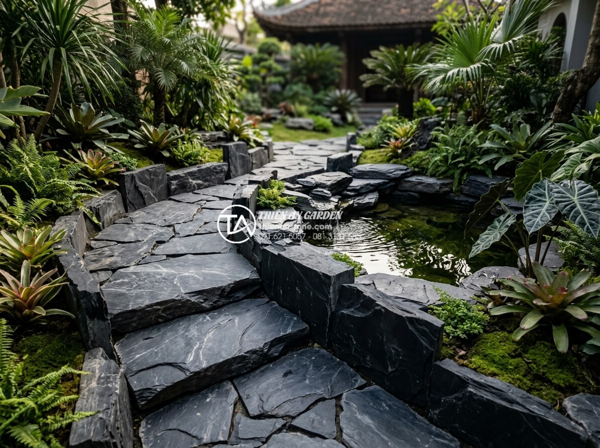 So sánh đá rối đen và đá rối đa sắc Lai Châu: Nên chọn loại nào? - Professional landscaping team from Thien An Stone completing a luxury garden ins