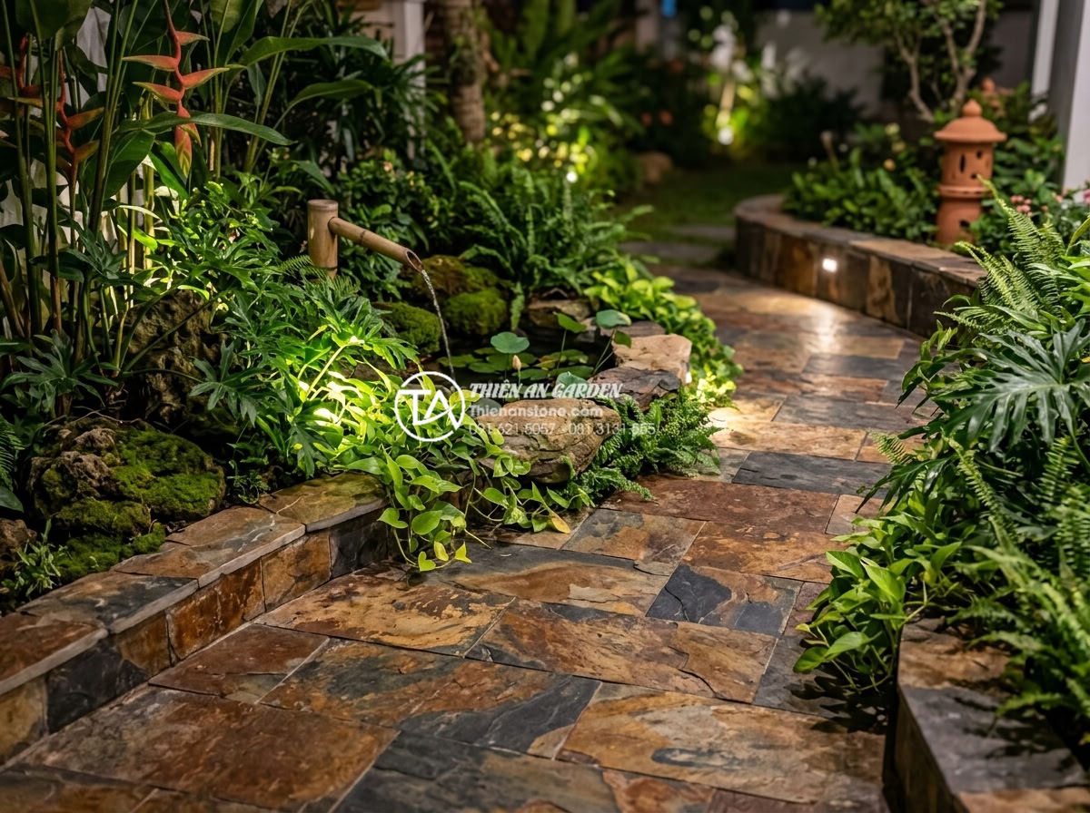Sự kết hợp giữa đá rối đa sắc và cây xanh trong thiết kế sân vườn - Nighttime garden scene with illuminated multi-colored Lai Chau stones intertwine