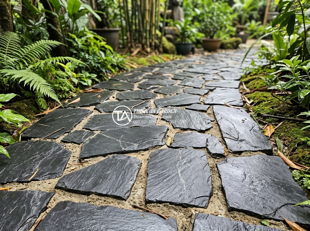 Tại sao nên dùng ốp gạch rối thay vì gạch men thông thường? - Detailed view of robust op gach roi installation on a high-traffic garden pathwa