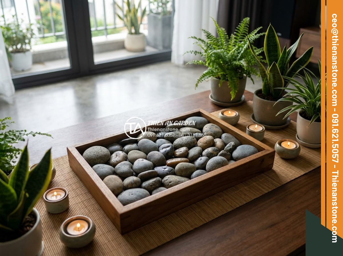 Tác dụng của đá cuội trong đời sống và ý nghĩa phong thủy bạn chưa biết - Collection of pebble stones in a shallow tray used for foot massage and relaxati