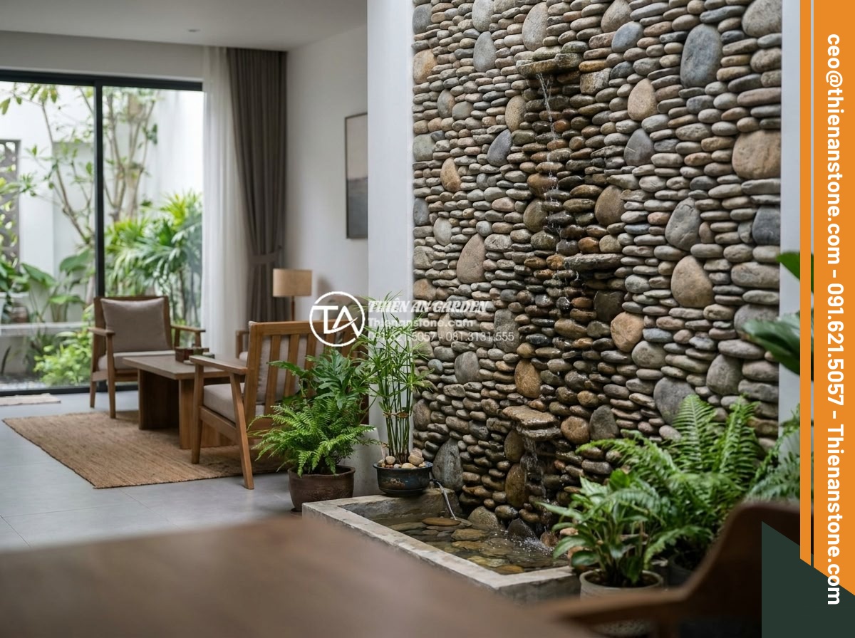 Tác dụng của đá cuội trong đời sống và ý nghĩa phong thủy bạn chưa biết - Pebble stones incorporated into indoor water fountain feature wall in contempora