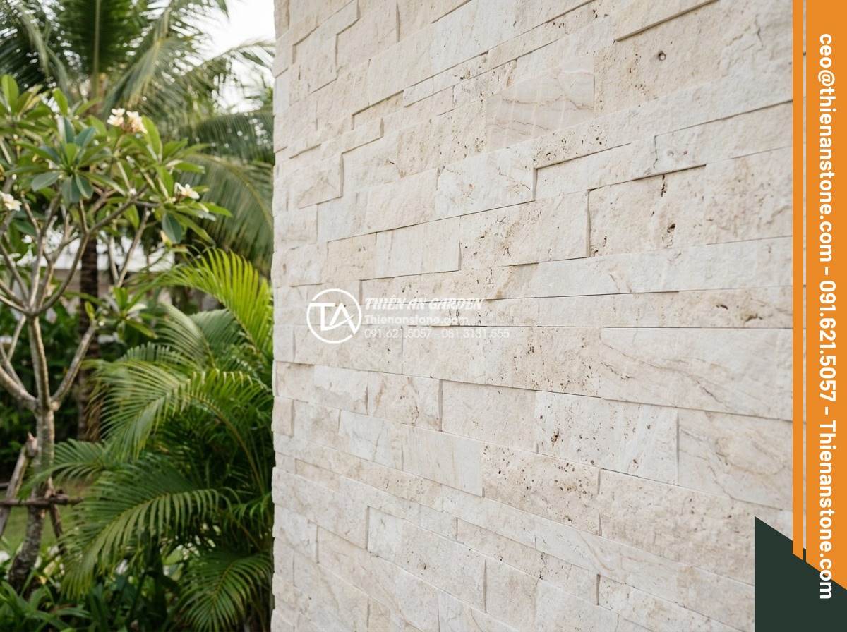 Cách phân biệt đá ghép tự nhiên thật và đá ghép nhân tạo kém chất lượng - Professional high-resolution photograph of a luxury villa exterior wall fully cl