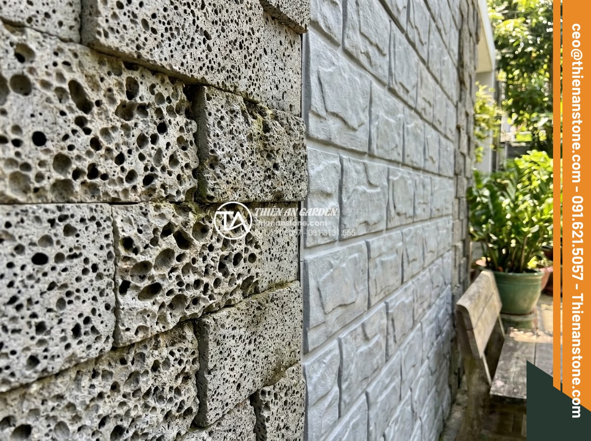 Đá ghép tổ ong xám: Xu hướng lựa chọn hàng đầu cho kiến trúc hiện đại - Modern wall section half-clad with natural honeycomb stone and half with fake st