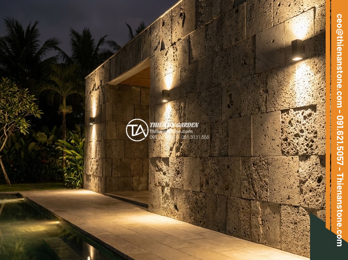Đá ghép tổ ong xám: Xu hướng lựa chọn hàng đầu cho kiến trúc hiện đại - Nighttime illuminated view of a modern villa using gray stacked honeycomb stone 