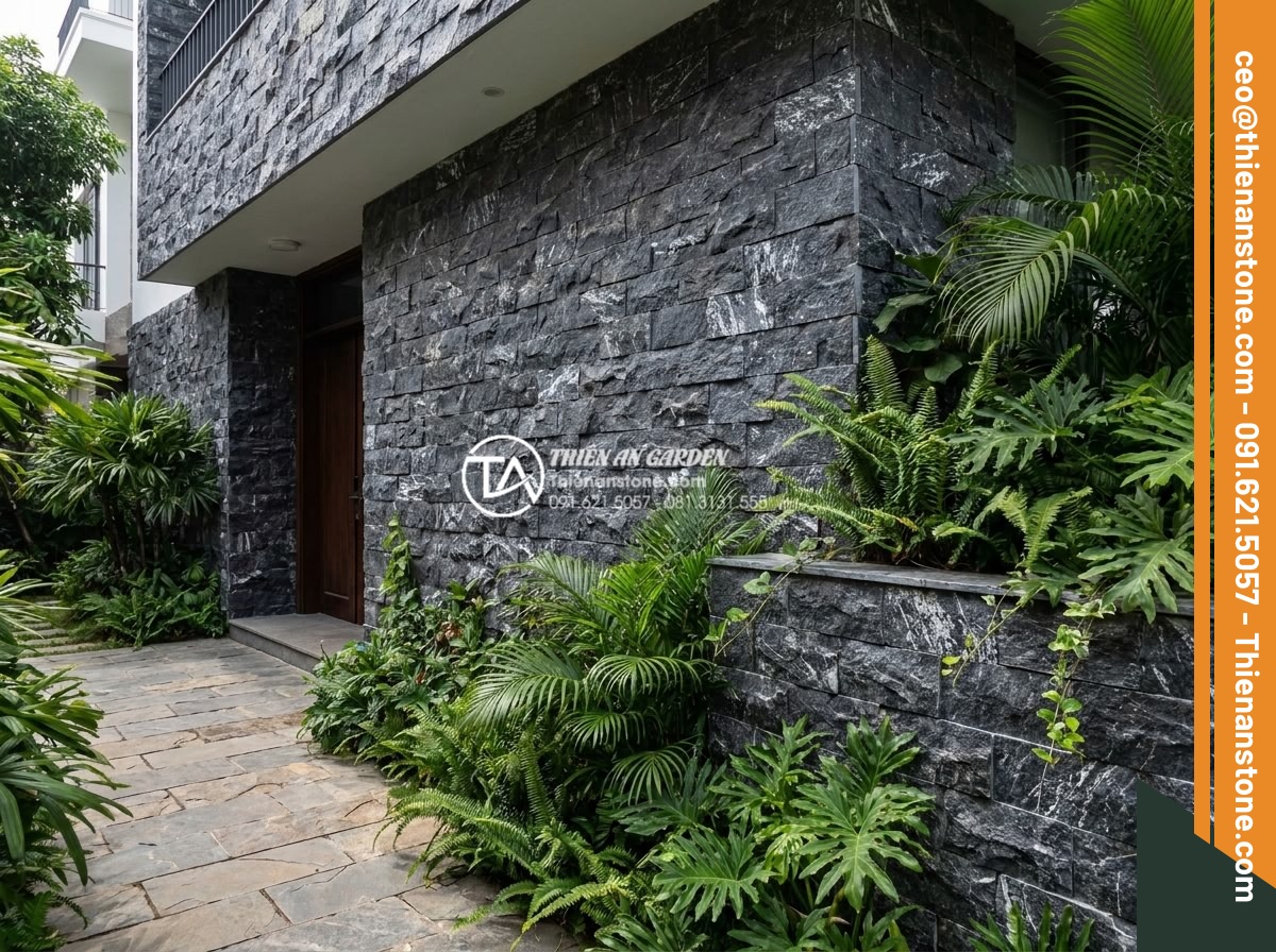 Đá ghép vân gỗ ốp tường: Giải pháp chống ẩm mốc tuyệt đối cho nhà phố - Hình 14 Đá ghép vân gỗ ốp tường: Giải pháp chống ẩm mốc tuyệt đối cho nhà phố - Exterior application of wood vein stone mosaic on townhouse facade and garden wa