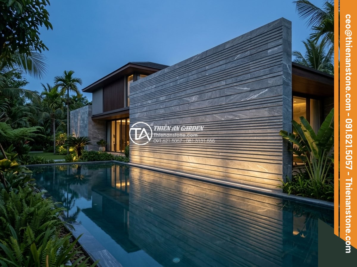 Đá răng lược đen: Vẻ đẹp huyền bí và đẳng cấp cho không gian sống - Dramatic evening photograph of modern luxury villa exterior wall fully clad in b