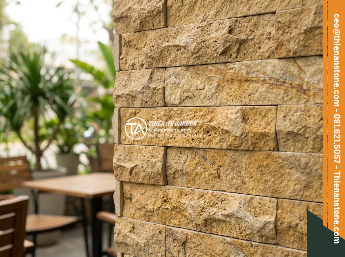 Khám phá vẻ đẹp mộc mạc của đá ong ghép 10x50 trong thiết kế Cafe sân vườn - Close-up view of rustic 10x50 honeycomb natural stone tiles with porous texture 