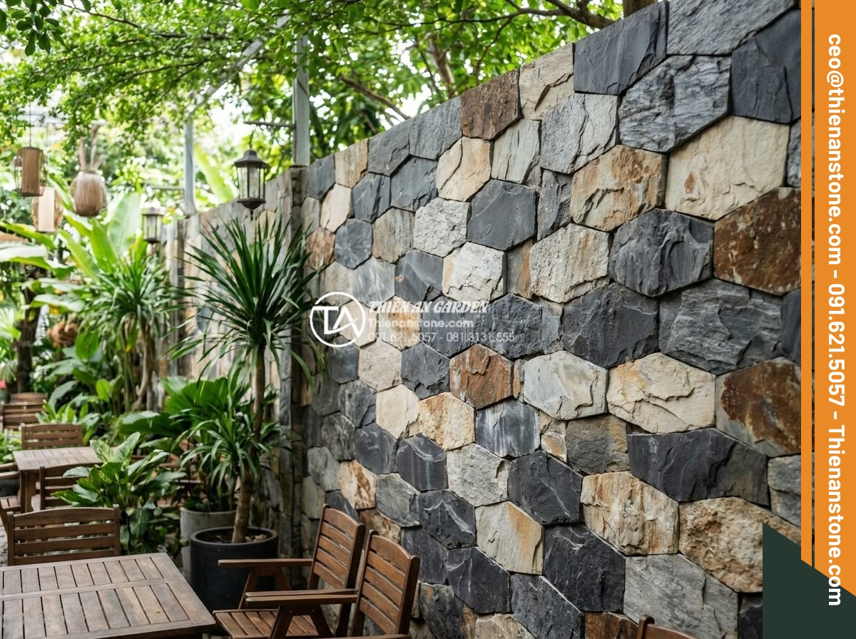 Khám phá vẻ đẹp mộc mạc của đá ong ghép 10x50 trong thiết kế Cafe sân vườn - Artistic view of rustic honeycomb stone 10x50 wall in a garden cafe setting with