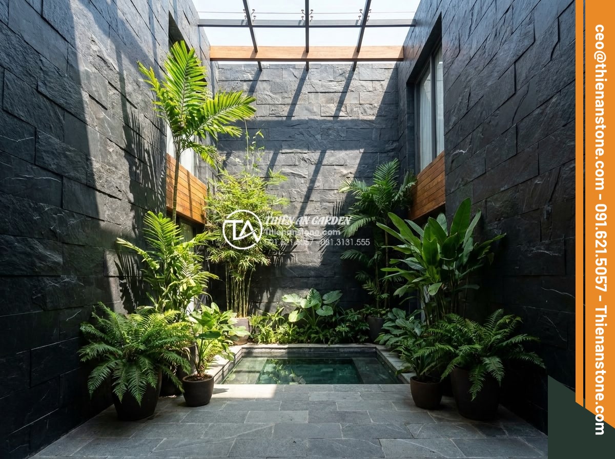 Kinh nghiệm chọn đá ghép đen ốp giếng trời tạo chiều sâu cho không gian - Luxurious modern atrium skywell interior featuring dark black stacked natural st