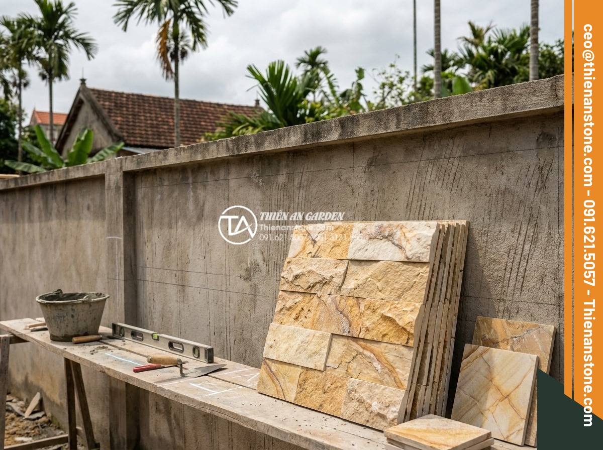 Quy trình thi công đá ghép tổ ong 10x50 cho tường rào và tiểu cảnh - Hình 9 Quy trình thi công đá ghép tổ ong 10x50 cho tường rào và tiểu cảnh - Construction worker performing detailed site survey and surface preparation on c