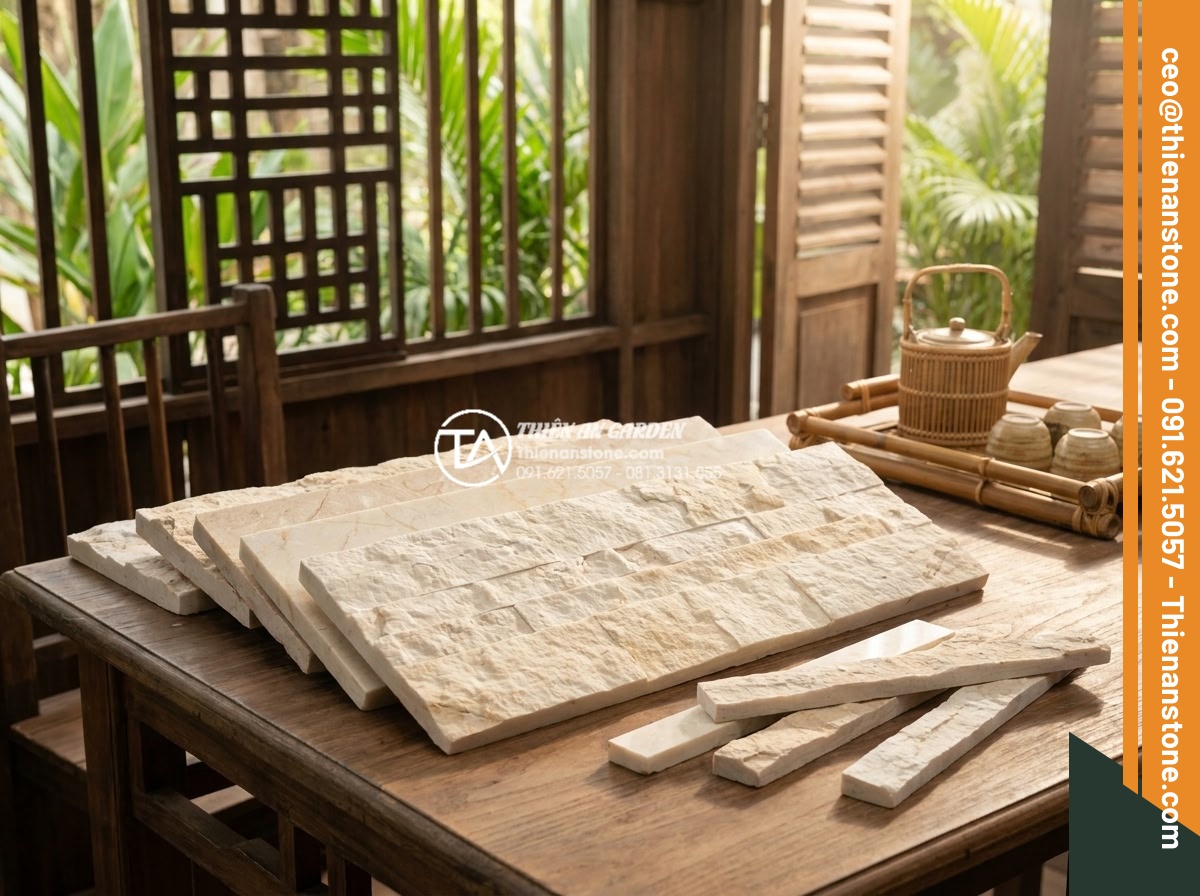 So sánh đá ghép tự nhiên và gạch giả đá: Nên chọn loại nào để ốp tường? - Expert consultation scene with natural stone samples being shown to clients for 