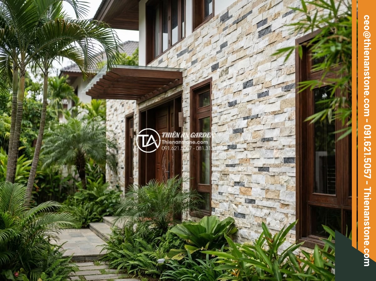 Tại sao nên dùng đá ghép vân gỗ thay cho gỗ tự nhiên khi ốp lát ngoài trời? - Elegant villa exterior with wood grain stone wall cladding harmonizing perfectly