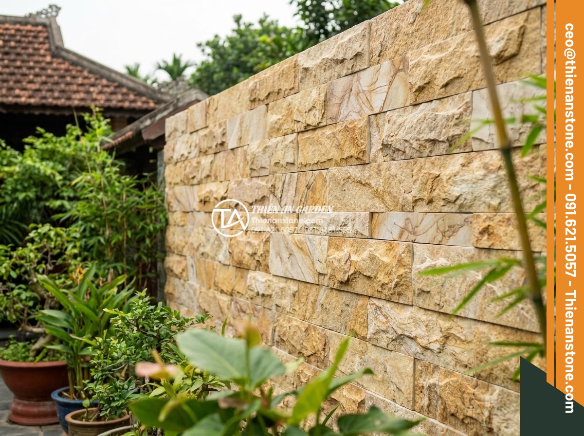 Tại sao nên dùng đá ghép vân gỗ thay cho gỗ tự nhiên khi ốp lát ngoài trời? - Completed outdoor stone wood grain cladding project with seamless professional j