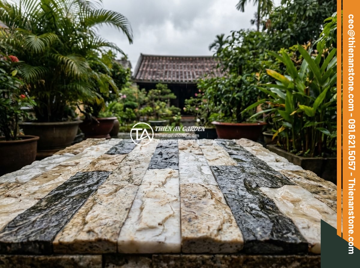 Tại sao nên dùng đá ghép vân gỗ thay cho gỗ tự nhiên khi ốp lát ngoài trời? - Durable wood grain stone mosaic tiles installed on an outdoor terrace enduring h