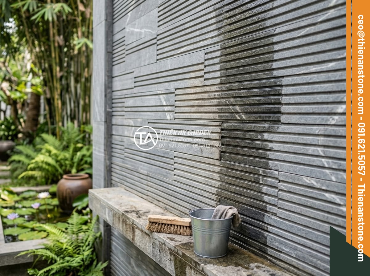 Tìm hiểu quy trình sản xuất đá chẻ răng lược thủ công tại làng nghề - Professional stone maintenance specialist carefully cleaning and applying protec