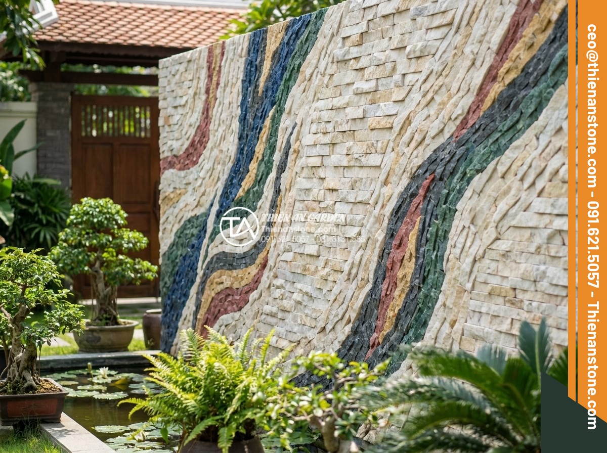 Tư vấn chọn màu đá ghép theo phong thủy rước tài lộc năm 2026 - Artistic stone mosaic wall featuring multiple feng shui colors in high-end villa