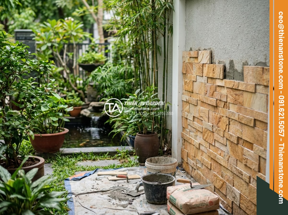Tư vấn chọn màu đá ghép theo phong thủy rước tài lộc năm 2026 - Professional installation process of natural stone mosaic in garden with feng sh