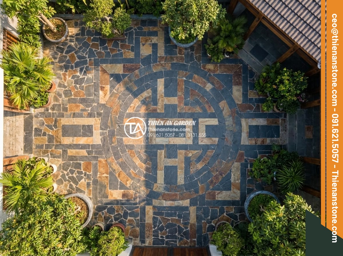 Tư vấn chọn màu đá ghép theo phong thủy rước tài lộc năm 2026 - Aerial view of modern villa courtyard featuring intricate stone mosaic patterns 