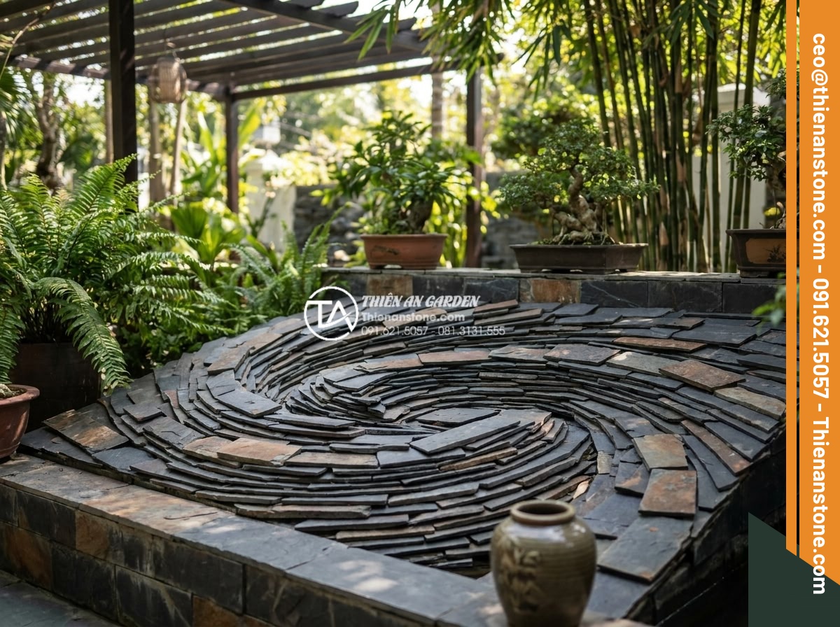 Tư vấn chọn màu đá ghép theo phong thủy rước tài lộc năm 2026 - Sophisticated black stone mosaic patterns in modern garden design symbolizing wa
