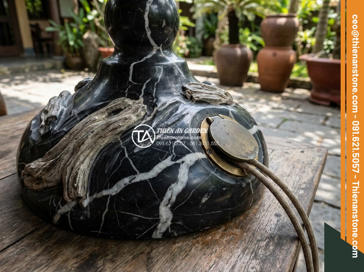 An toàn điện khi lắp đặt tiểu cảnh chum nước ngoài trời: Những điều cần biết - Close-up of carved stone chum base with integrated safe electrical pass-throughs