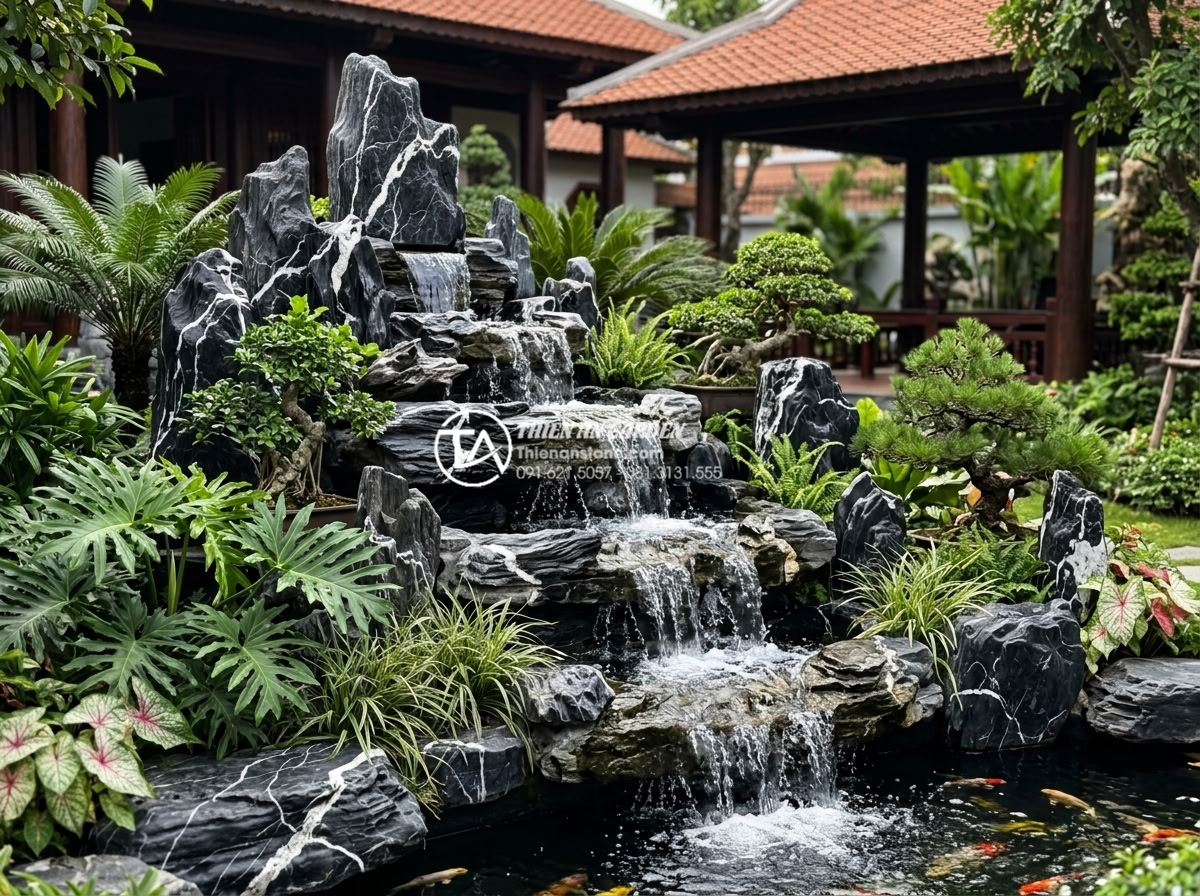 Review 5 loại đá tự nhiên tốt nhất để làm tiểu cảnh nước chảy bền đẹp - White snow mountain stone with black veins forming an elegant multi-tier waterfa