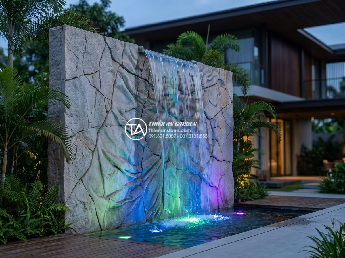 Tiểu cảnh vách tường là gì? 7 xu hướng thiết kế tiểu cảnh vách tường 2026 - Spectacular evening photograph of a modern Vietnamese luxury villa featuring a v