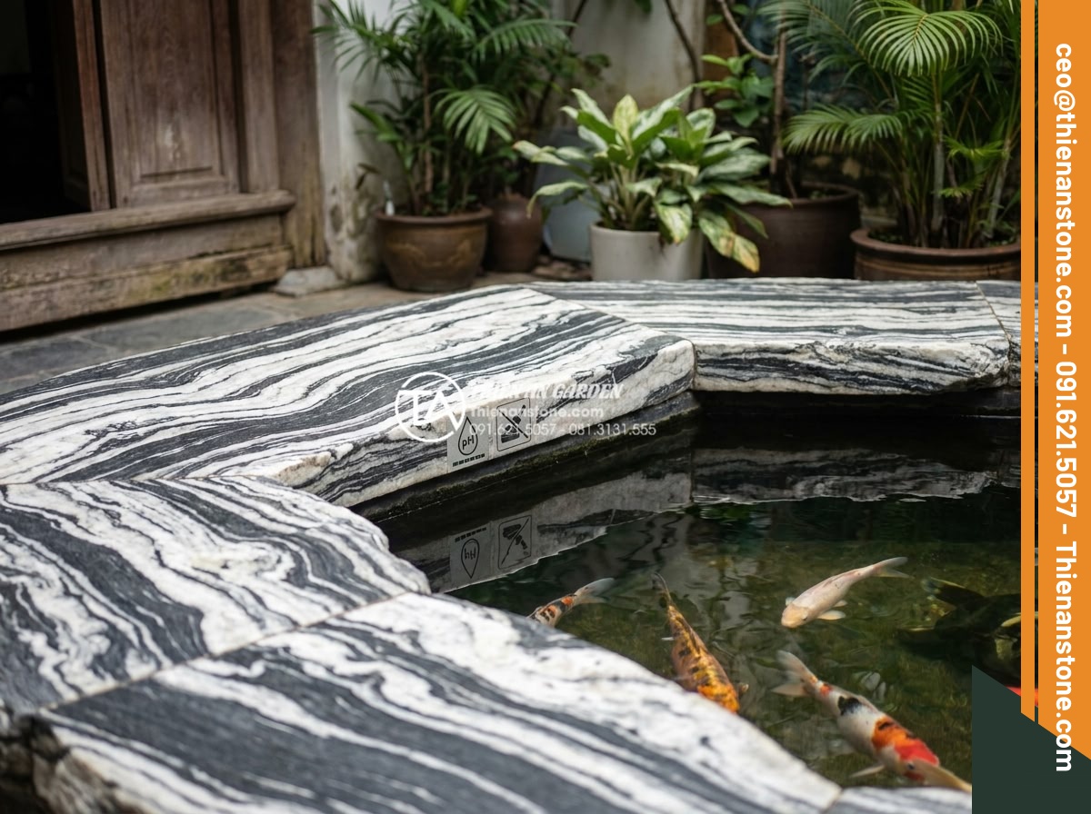 Báo giá đá tuyết sơn mới nhất 2026: Đơn giá theo tấn và theo khối - Koi pond setup with snow mountain stone borders and warning icons for pH testing