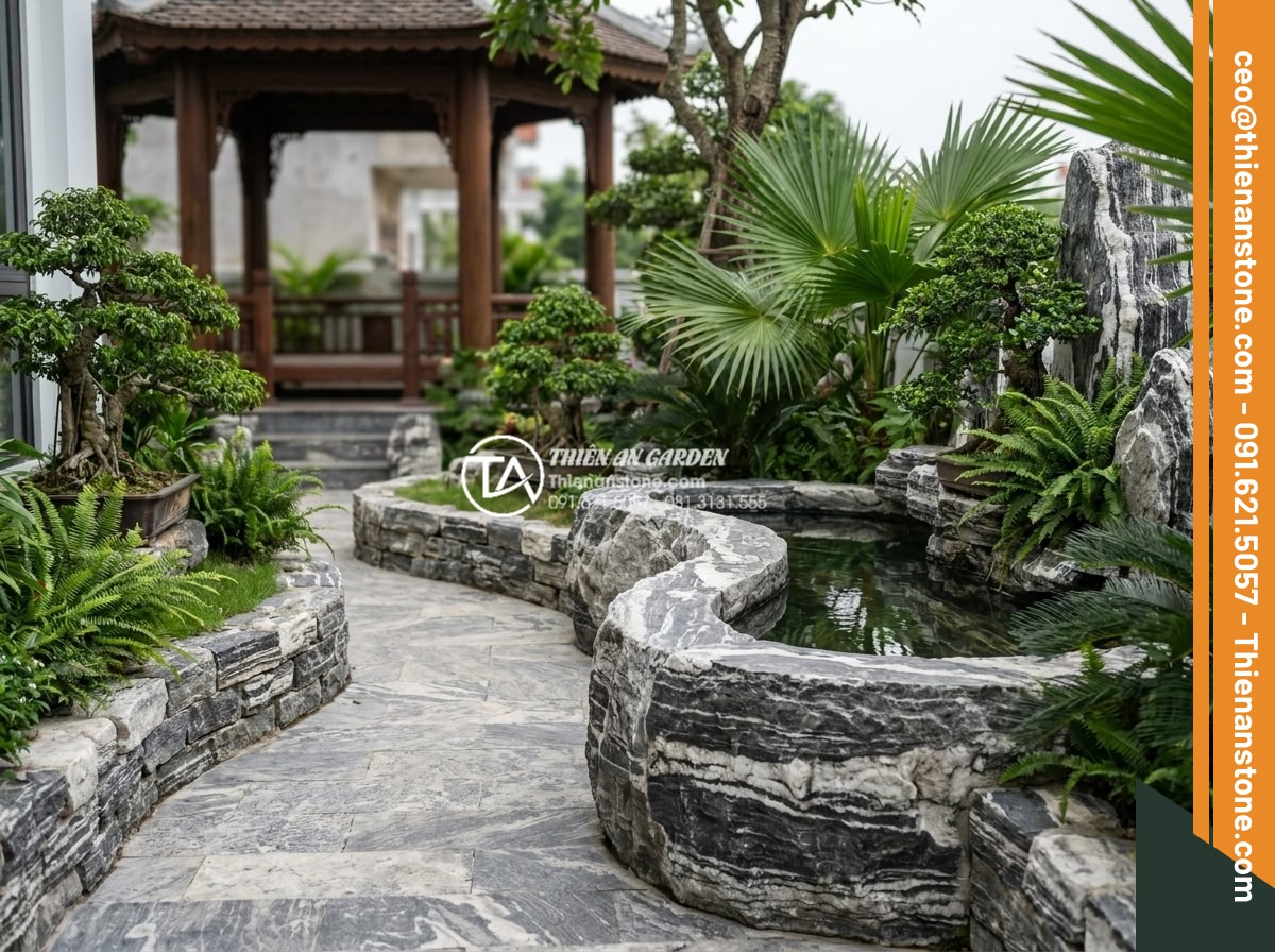 Báo giá đá tuyết sơn mới nhất 2026: Đơn giá theo tấn và theo khối - Completed luxury garden project using snow mountain stone with happy clients and