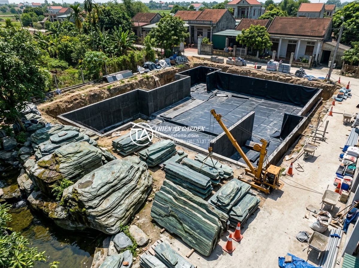 Case Study: Thi công hồ cá Koi 500 triệu sử dụng toàn bộ đá xanh Nhật Bản - Detailed aerial view of the construction site during excavation phase for the 50