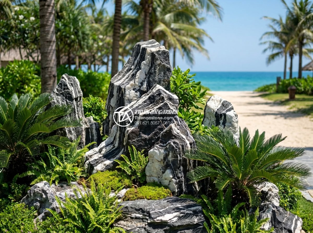 Đá tuyết sơn là gì? Cẩm nang toàn tập về loại đá quý hiếm trong kiến trúc - Long-term outdoor installation of da tuyet son rockery in a coastal Vietnamese r