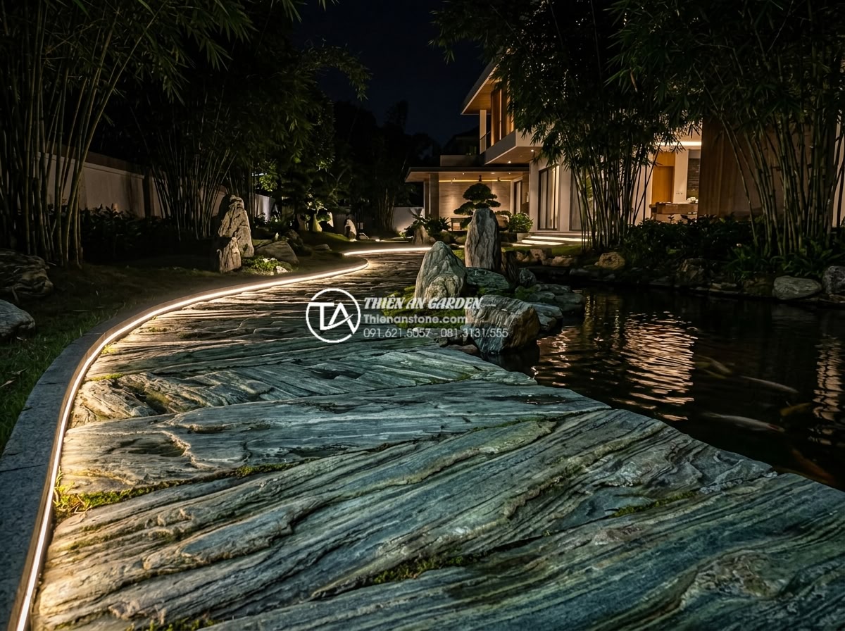Mẫu lối đi sân vườn lát đá xanh Nhật Bản: Đơn giản nhưng đầy tinh tế - Nighttime realistic photograph of Japanese green stone pathway with modern LED l