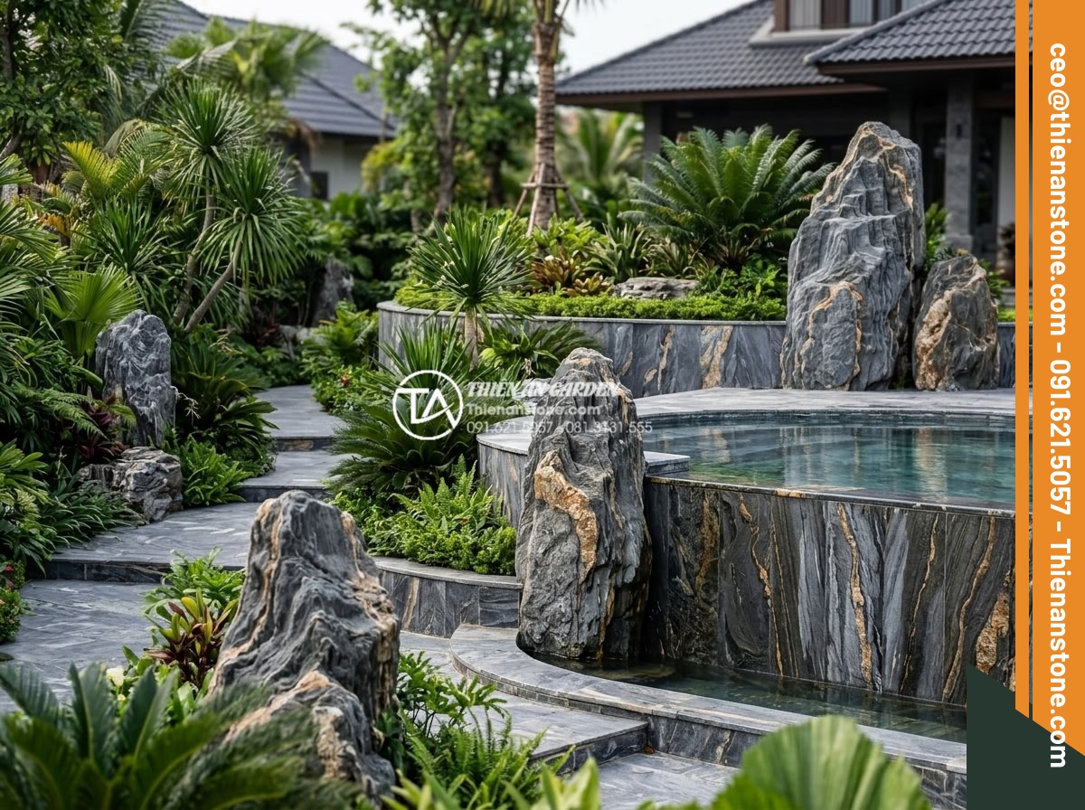So sánh đá trầm tích và đá Granite trong thi công sân vườn - Granite rock formations used as decorative boulders and retaining walls in a lux
