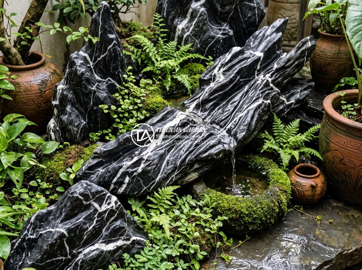 Checklist 12 vật liệu không thể thiếu khi thi công tiểu cảnh góc sân - Close-up of premium natural stones and carved rock elements arranged in a cozy g