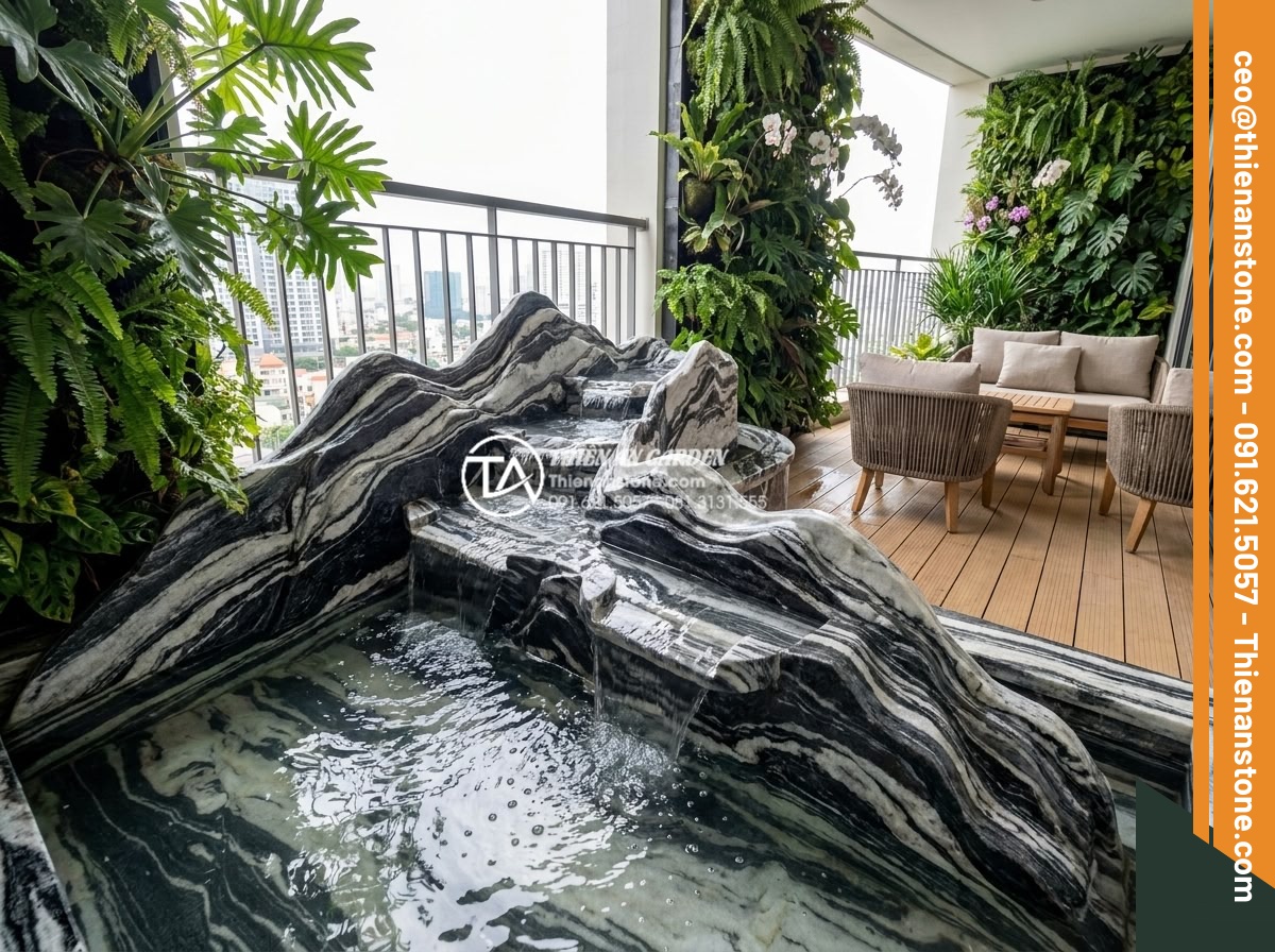 Ý tưởng thiết kế thác nước mini bằng đá tuyết sơn cho ban công - Serene wide-angle view of an elegant modern balcony featuring a cascading mini w
