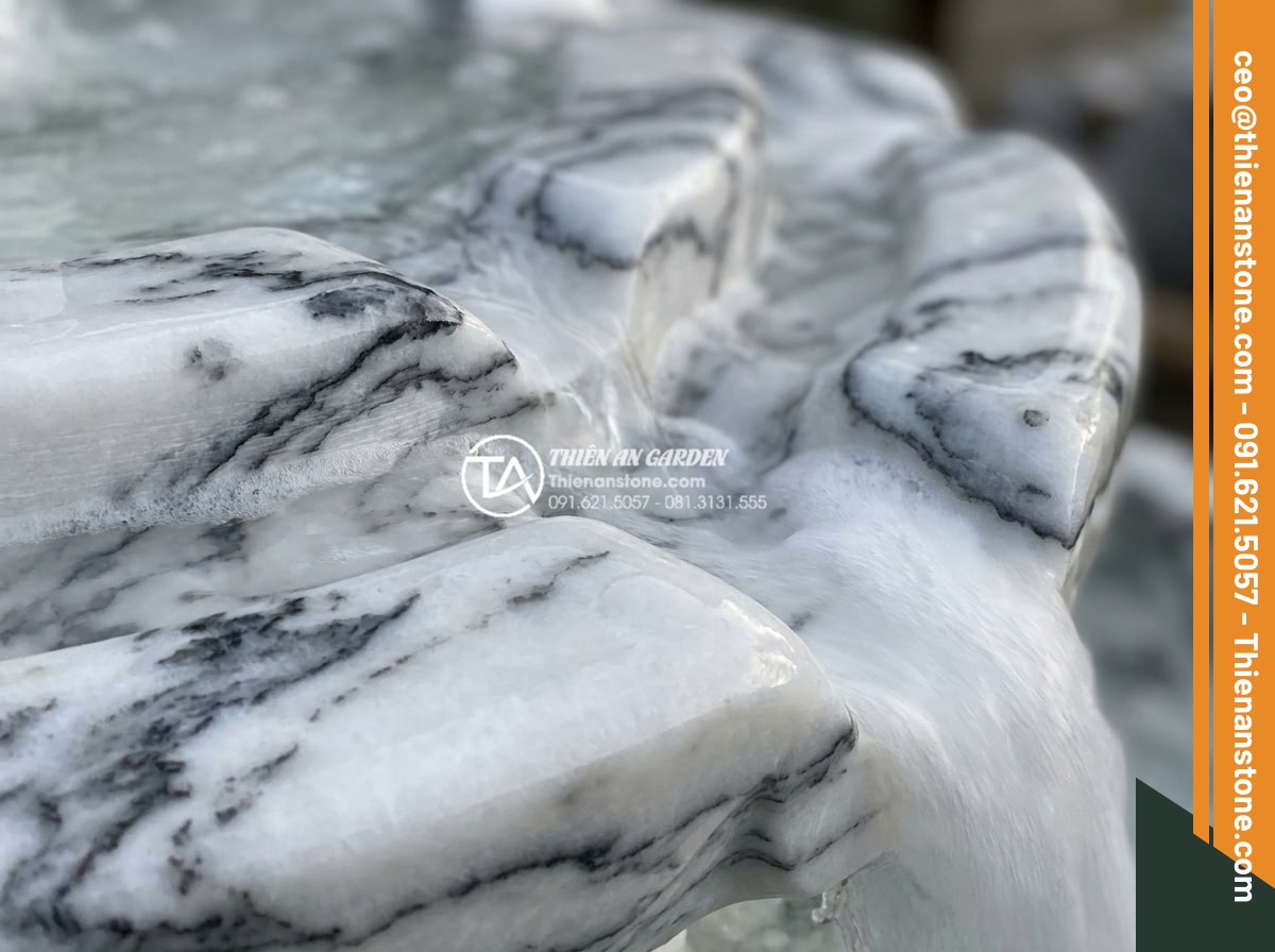 Ý tưởng thiết kế thác nước mini bằng đá tuyết sơn cho ban công - Extreme close-up realistic photograph of hand-carved snow stone waterfall tiers 