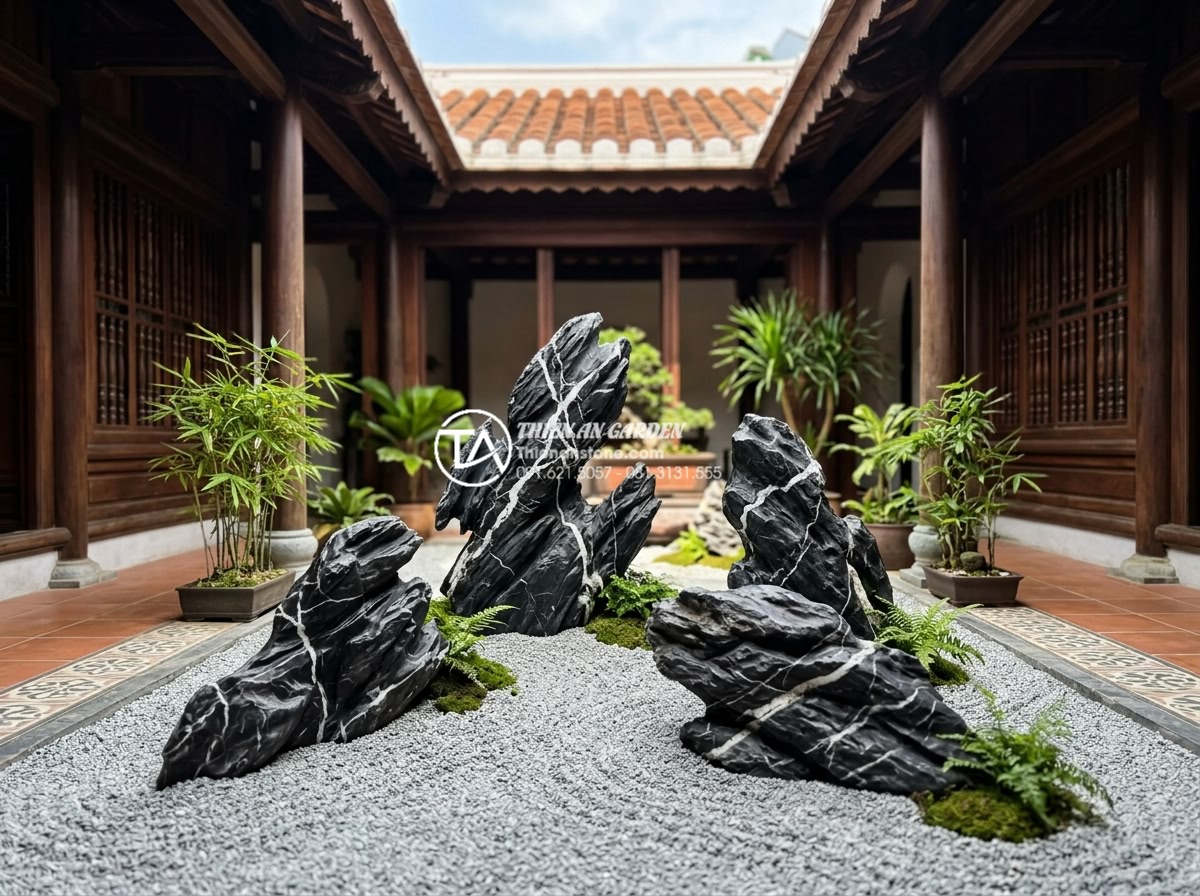 Cách chọn đá cuội và đá cảnh cho tiểu cảnh giếng trời khô - Elegant decorative stones placed according to feng shui principles in a sky-well
