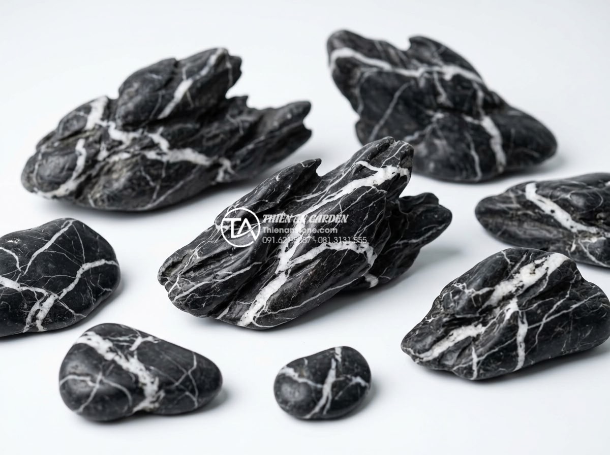 Cách chọn đá cuội và đá cảnh cho tiểu cảnh giếng trời khô - Variety of natural river pebble stones in different sizes, colors like gray, whi