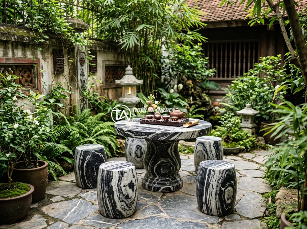 Case Study: Biến sân sau nhà phố chật hẹp thành ốc đảo xanh với đá cảnh - Realistic photo of the elegant stone tea table area in the completed backyard wi