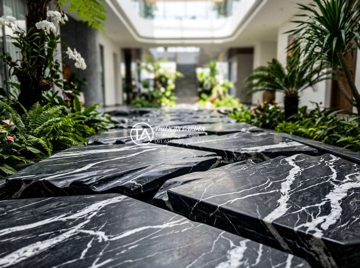 Sử dụng đá bước dặm và sỏi trắng trong trang trí tiểu cảnh giếng trời - Hình 3 Sử dụng đá bước dặm và sỏi trắng trong trang trí tiểu cảnh giếng trời - Close-up of textured natural stepping stones arranged in a geometric pattern wit