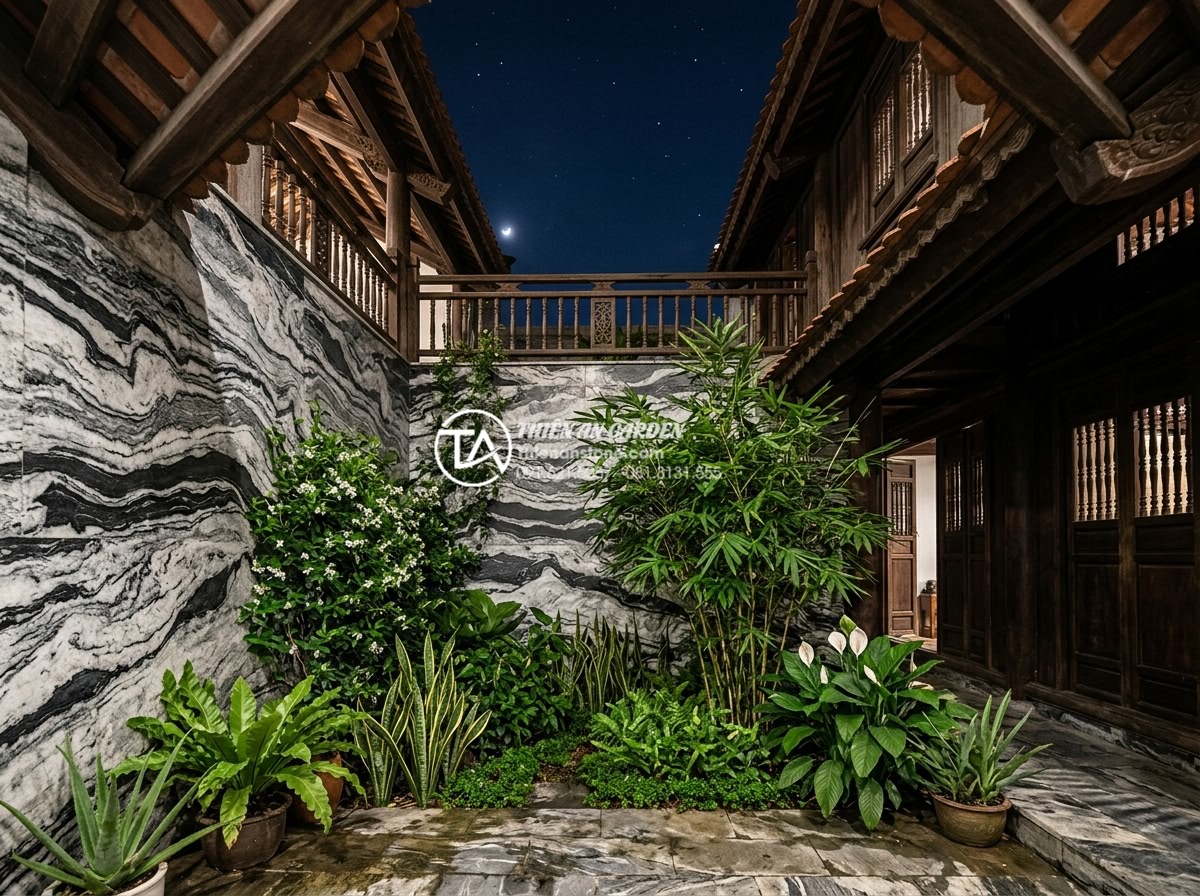 Tác dụng của tiểu cảnh giếng trời đối với sức khỏe và tâm trạng - Nighttime skywell view with soft natural light, stone features, and plants promo
