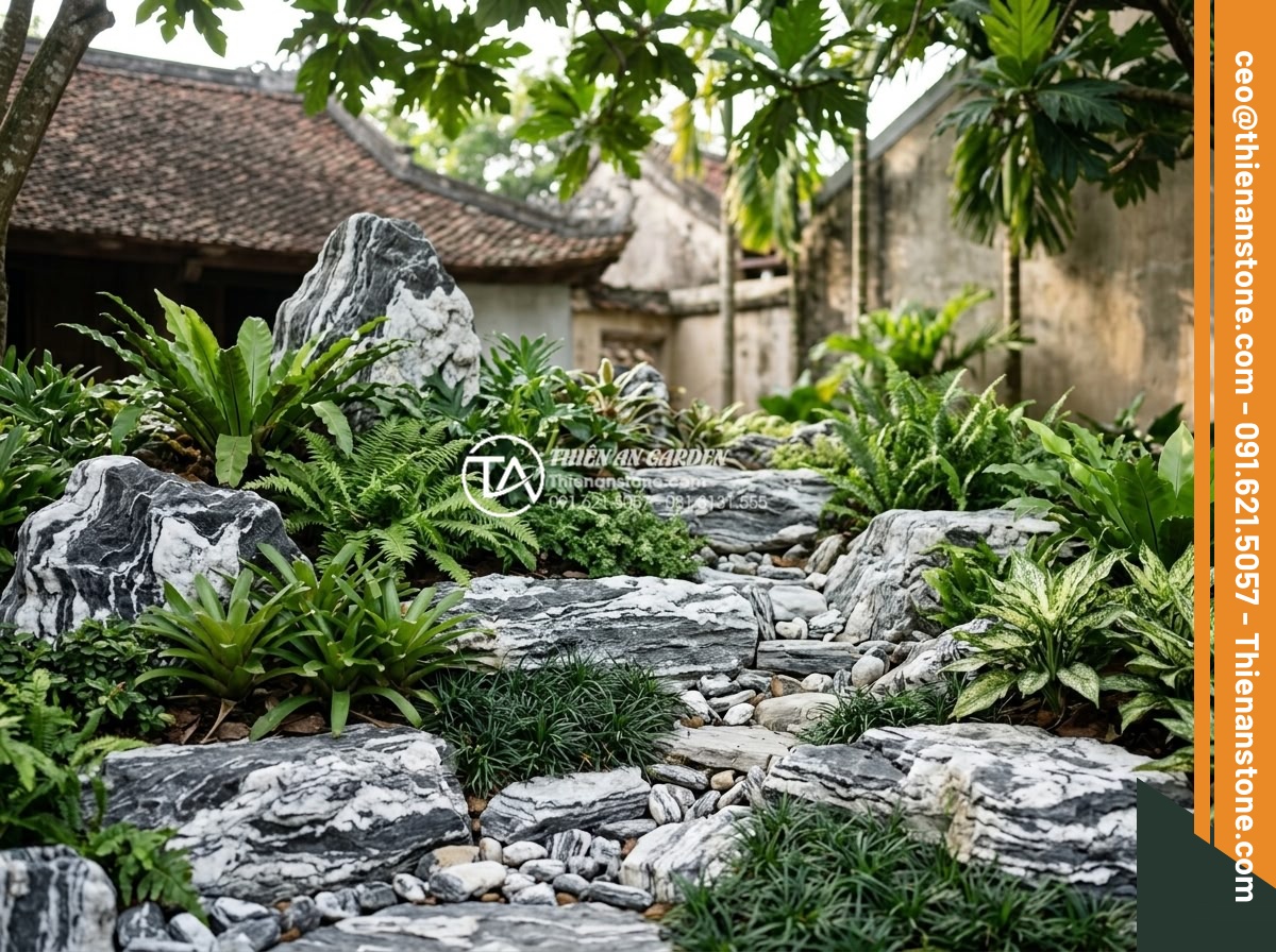 Thiết kế tiểu cảnh trước nhà: 10 nguyên tắc vàng kiến tạo không gian sống - Well-maintained sustainable rockery garden with natural stones, integrated drain