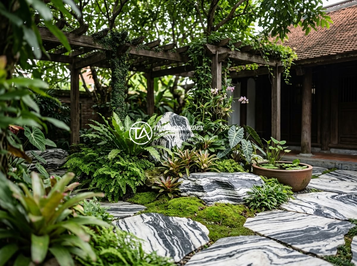 Top 10 loại cây chịu bóng râm cực tốt cho tiểu cảnh sân sau nhà phố - Professional stone and plant combination in shaded patio landscape
