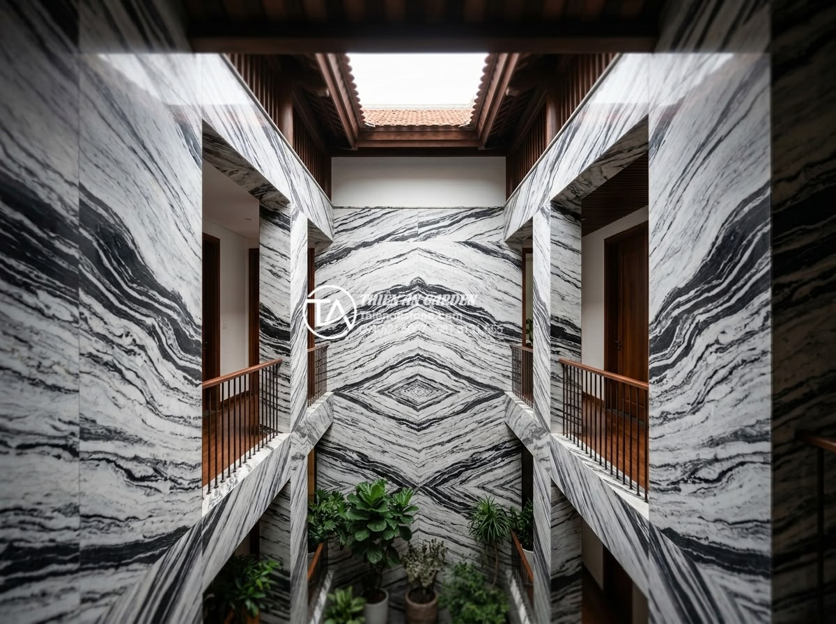 Top 5 loại đá tự nhiên ốp tường giếng trời bền đẹp và sang trọng nhất - Well-maintained luxurious stone clad light well after years of use looking prist