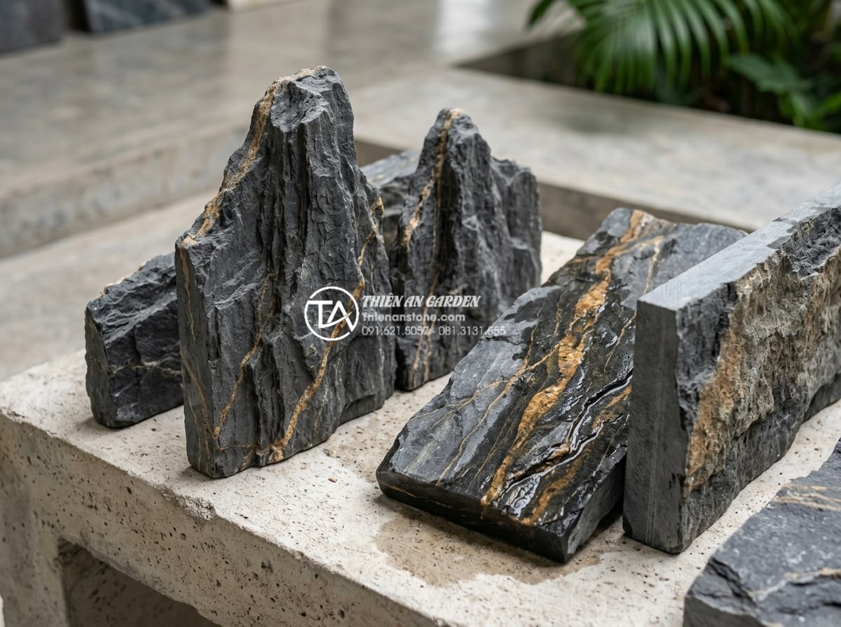 Top 5 loại đá tự nhiên ốp tường giếng trời bền đẹp và sang trọng nhất - Close-up of various natural stone samples for atrium wall cladding showing textu